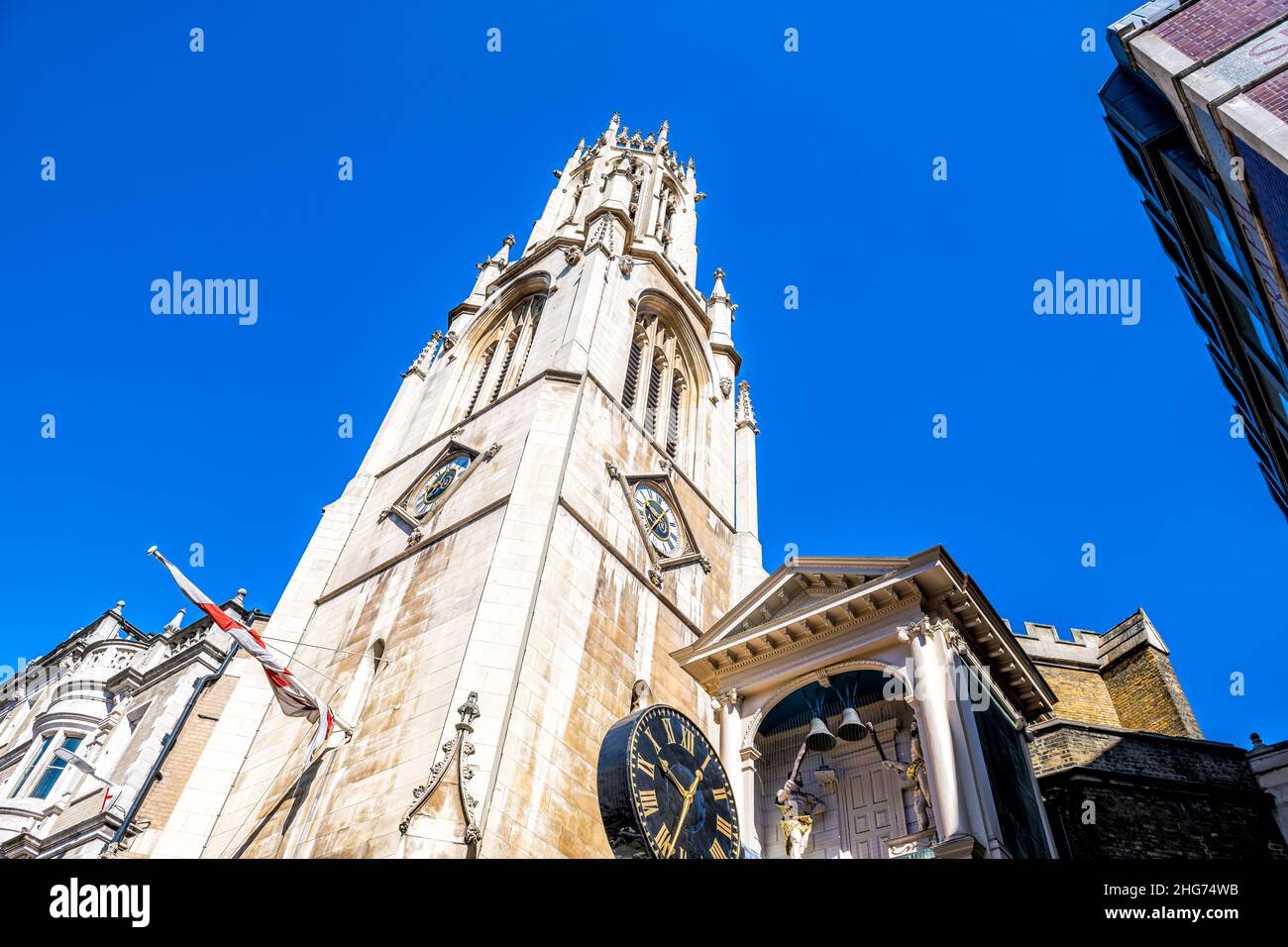 London, UK Low angle view looking up on St Dunstan-in-the-West church in center of downtown district city with old architecture on Fleet street and cl Stock Photo
