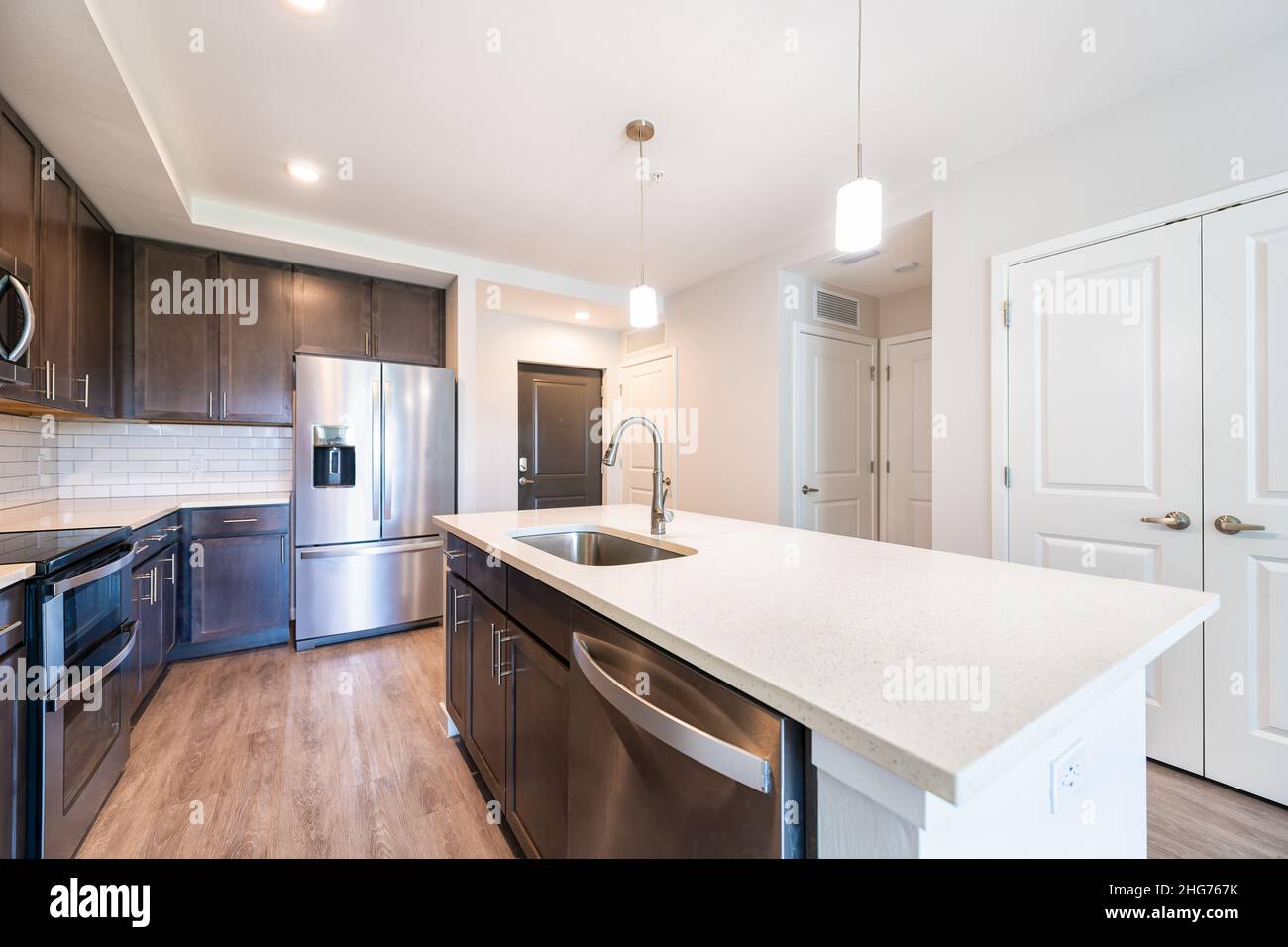 Empty vacant kitchen open plan modern apartment with sink faucet quartz