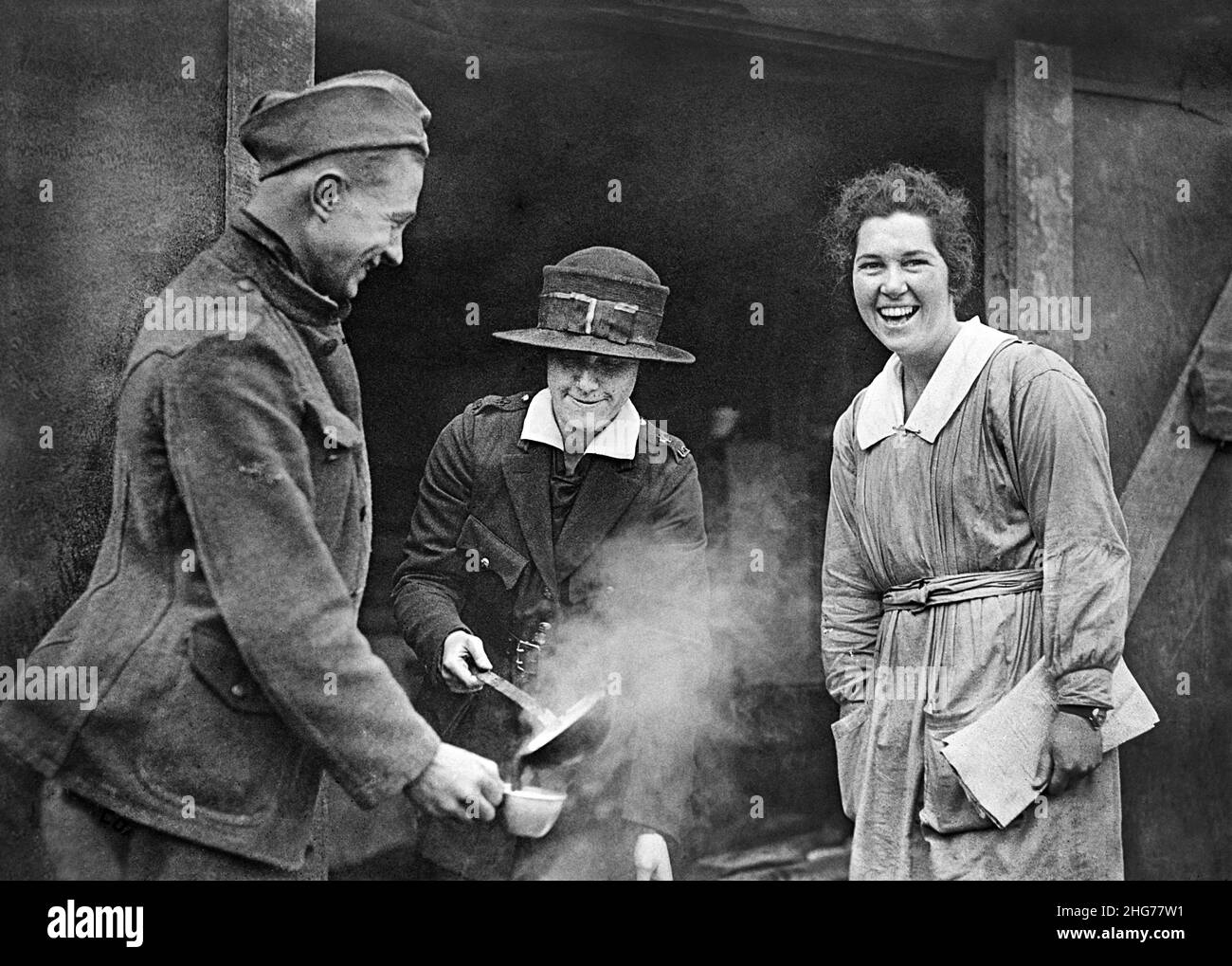 Miss Anna Rochester of Buffalo, New York, USA, serving chocolate to Pvt. Henry Schwenks, of the 326th Infantry, Co. A, 82nd Division, Canteen at American Red Cross Evacuation Hospital #6 & 7, Souilly, France, American National Red Cross Photograph Collection, March 12, 1919 Stock Photo