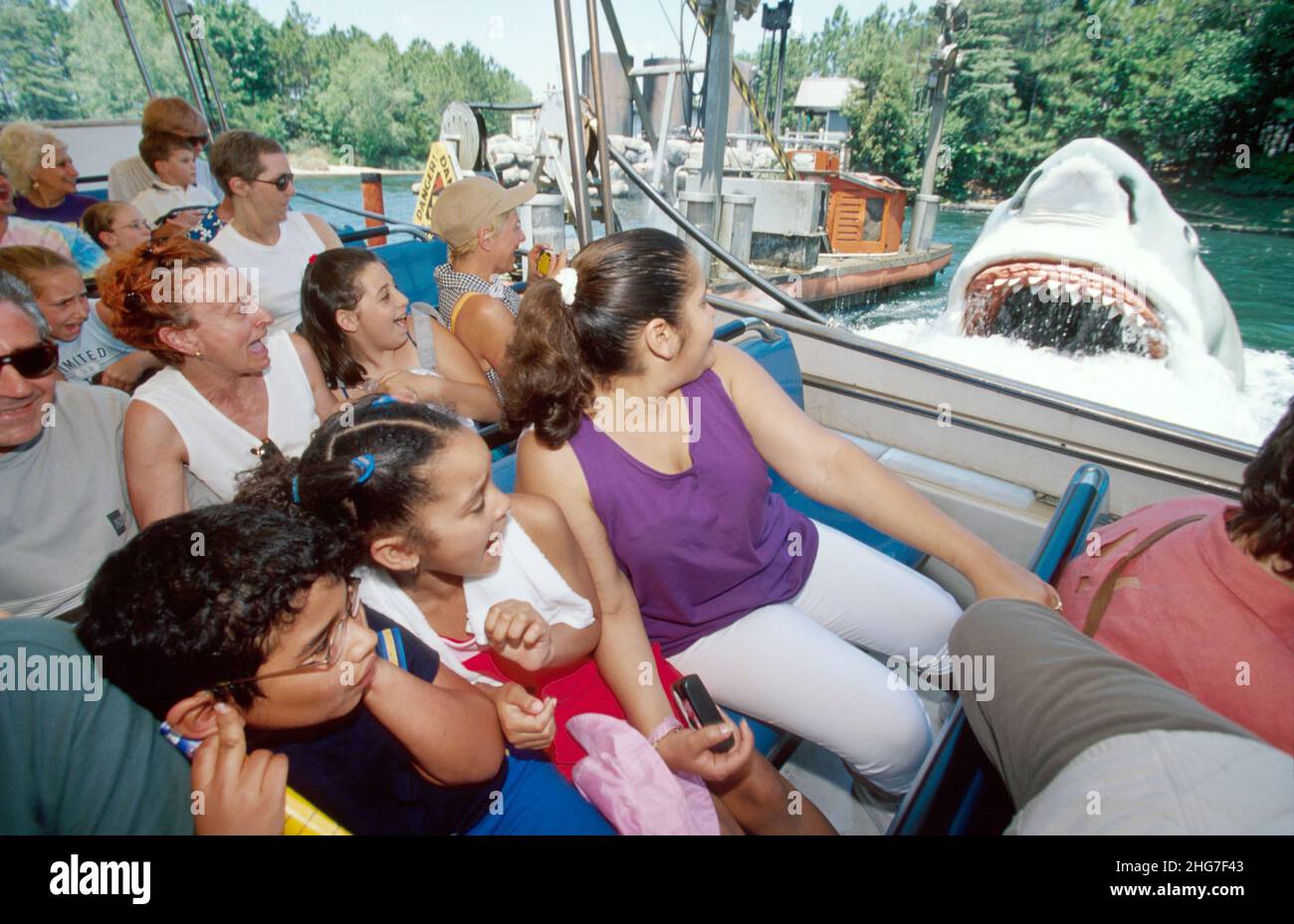 Orlando Florida,Universal Studios,Jaws shark attacking passengers terror thrill boat ride,family Hispanic boy girl mother reacting lifelike scaring Stock Photo