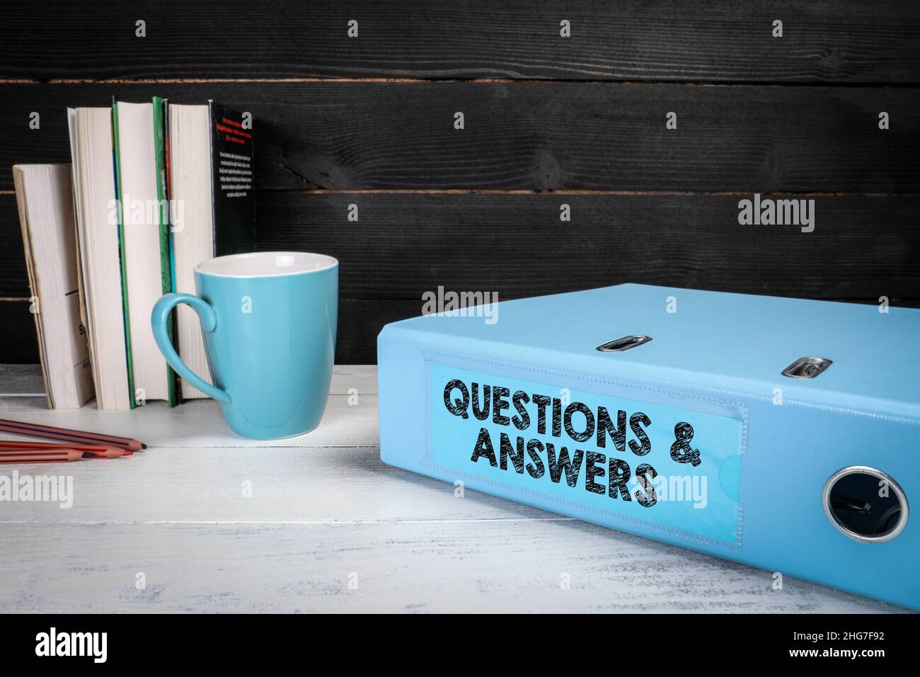 Questions and Answers. Document folder, binder on office desk Stock