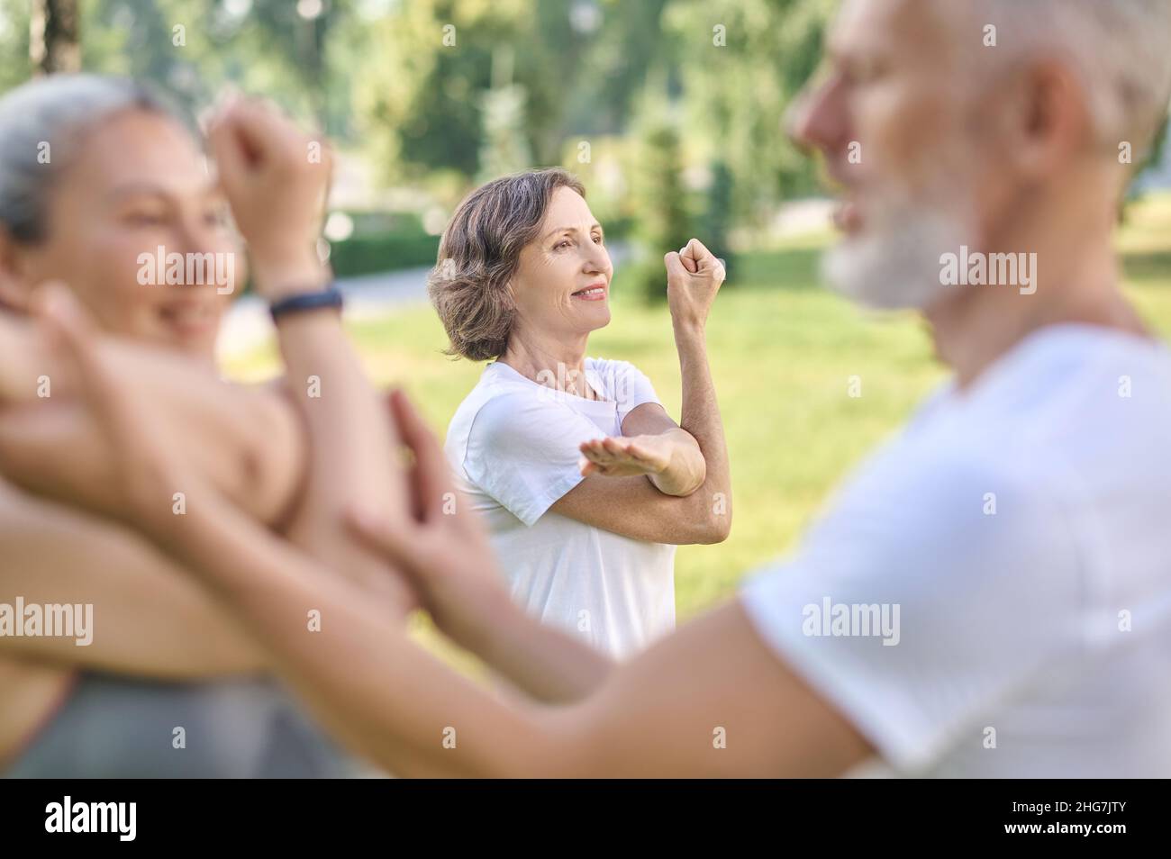 Male instructor checking the correctness of the exercise Stock Photo ...