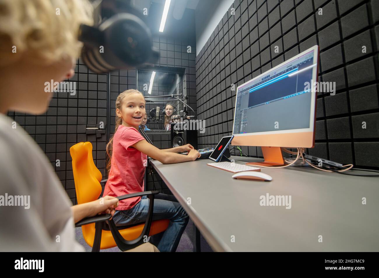 Group of children recording a song in the studio Stock Photo Alamy