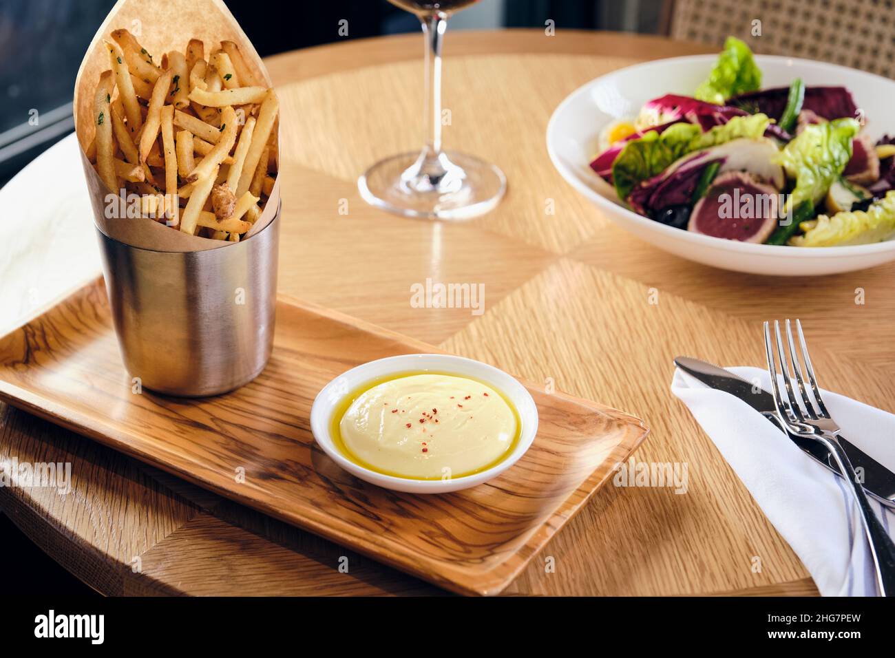 Gourmet French fries with ahi tuna salad Stock Photo Alamy