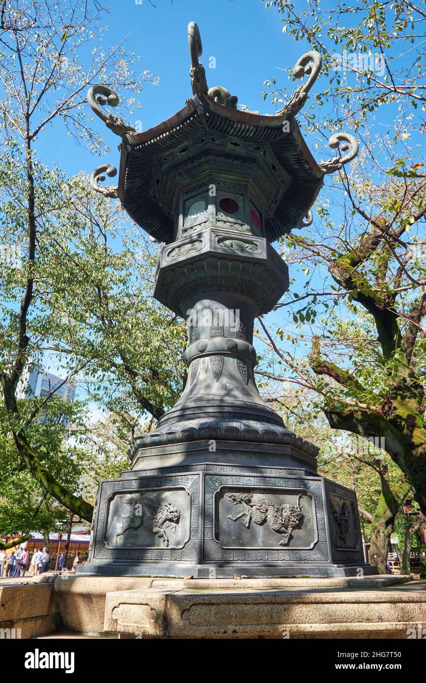 The view of Kasuga-doro bronze lantern in the garden of Yasukuni Shrine (Peaceful Country) in Chiyoda, Tokyo. Japan Stock Photo
