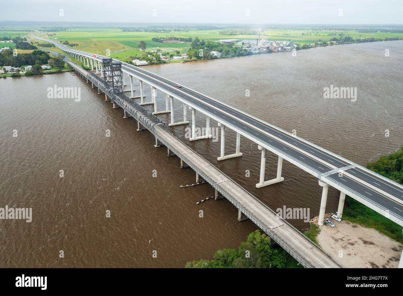 Aerial view of Pacific Highway crossing the Clarence River over the new and old bridges at Harwood in the Northern Rivers, NSW, Australia. Stock Photo