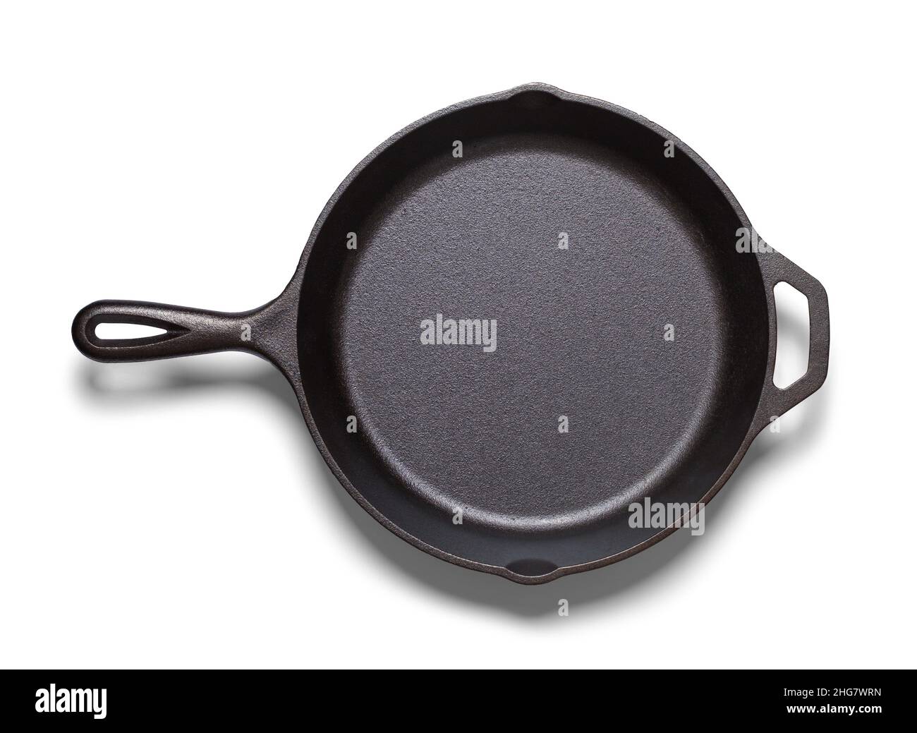 Cast Iron Frying Pan Top View Cut out on White. Stock Photo