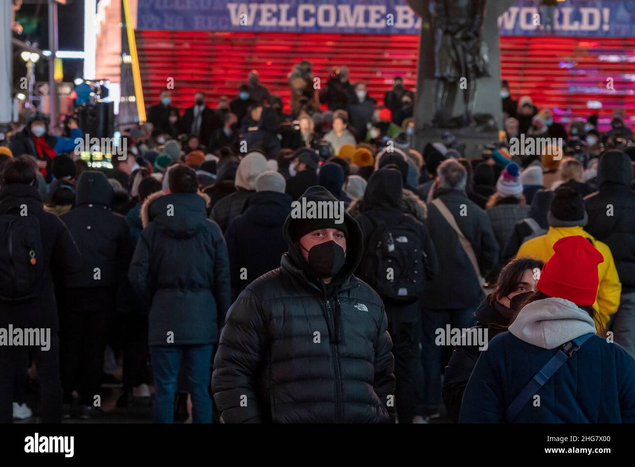 Hundreds of people attend a candlelight vigil in Times Square for