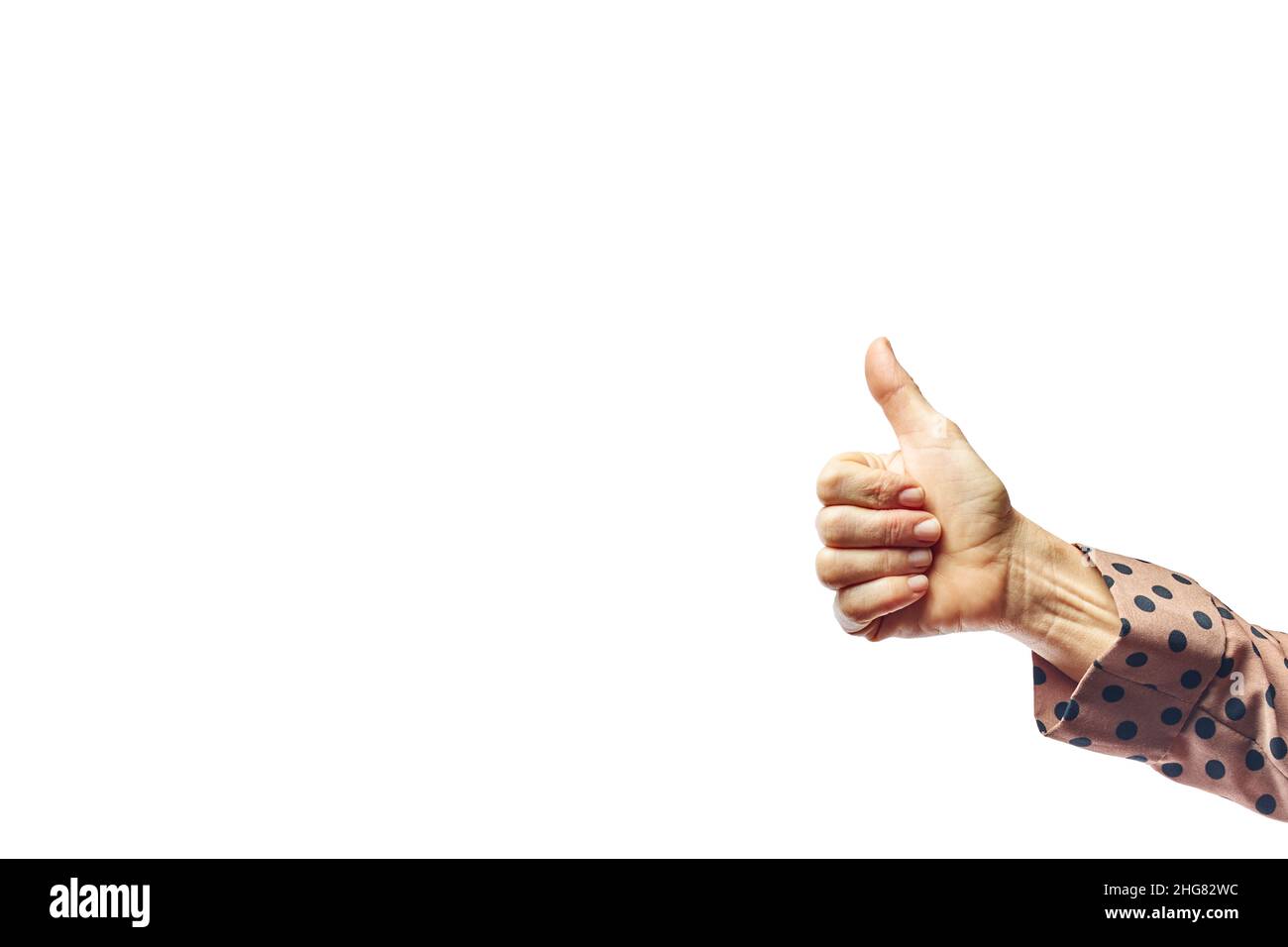 Hand showing thumb up sign against isolated on white background. Woman showing OK sign Stock Photo