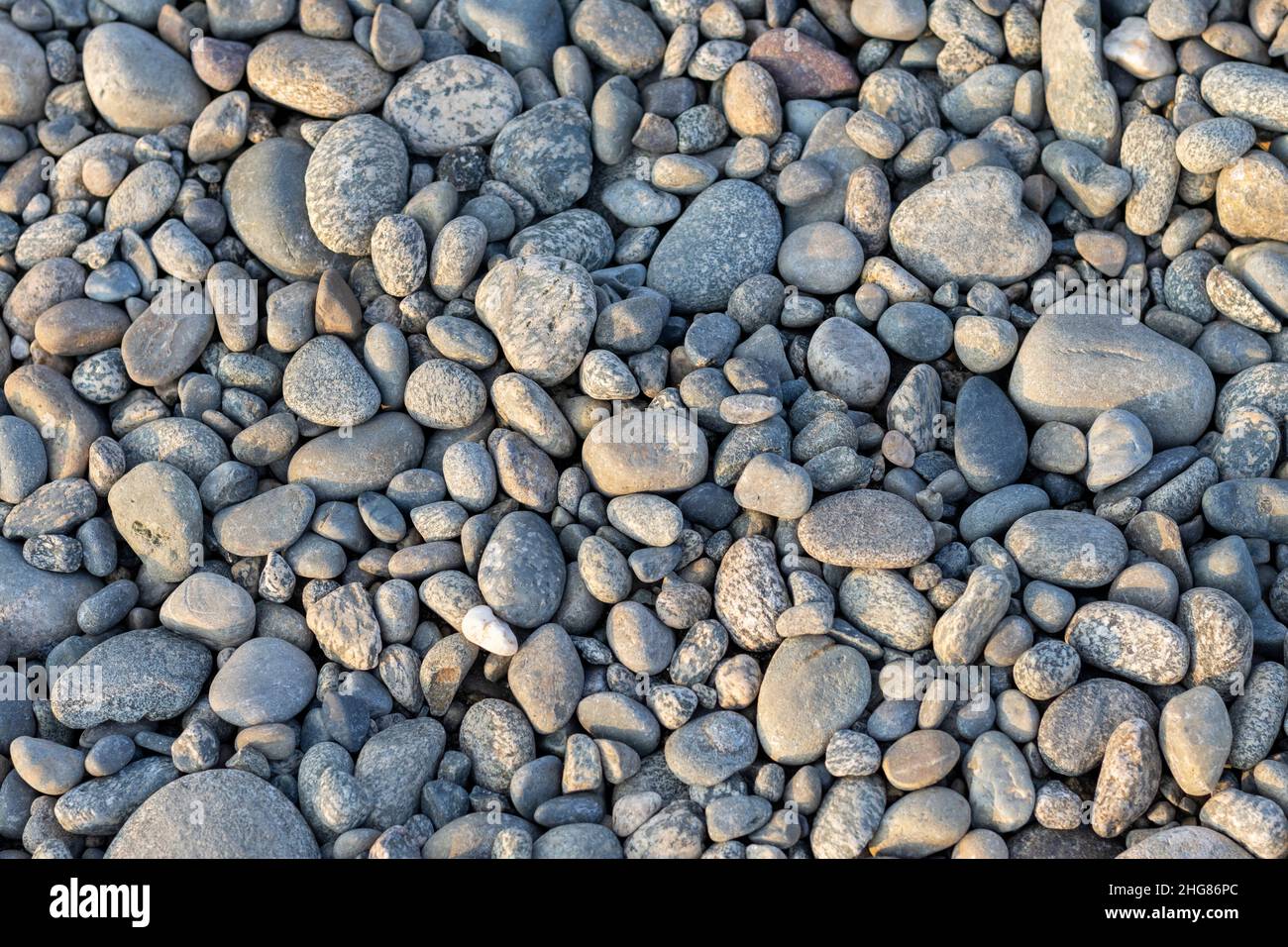 Natural river stone pebbles texture or background Stock Photo