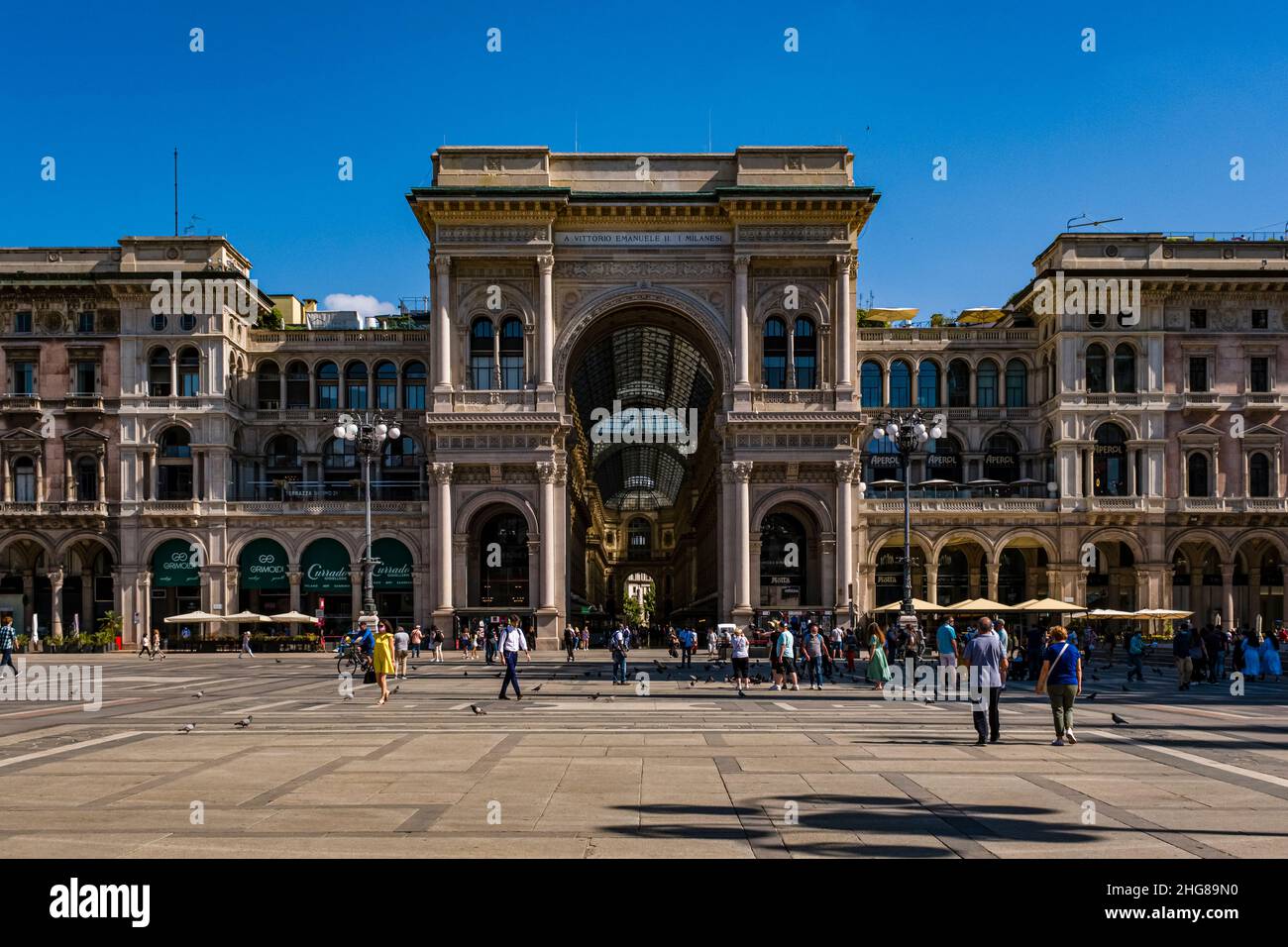 The facade of Galleria Vittorio Emanuele II, Italy's oldest active shopping gallery, seen from Cathedral Square, Piazza del Duomo. Stock Photo