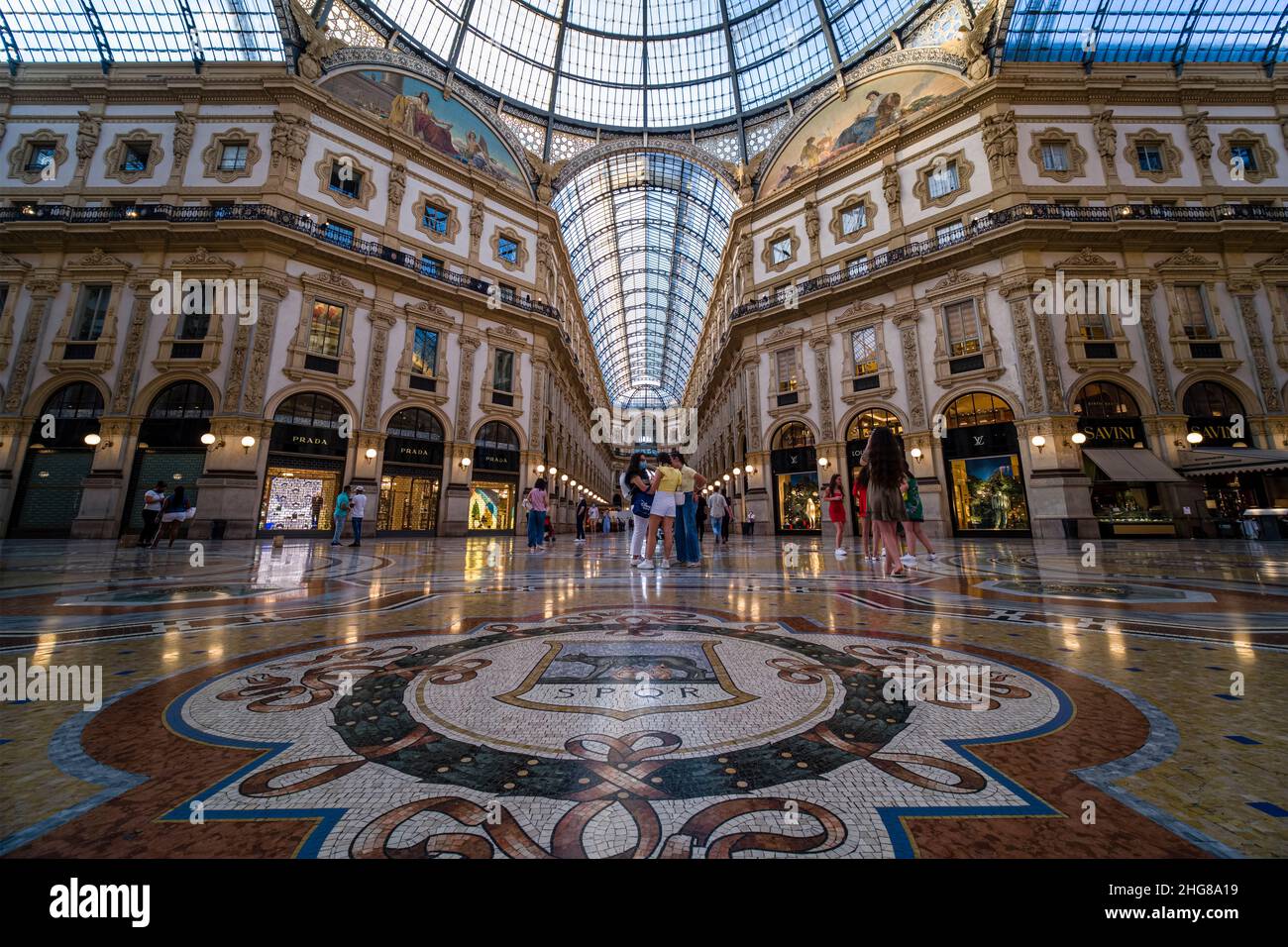 Interior panoramic view of Galleria Vittorio Emanuele II, Italy's oldest active shopping gallery. Stock Photo