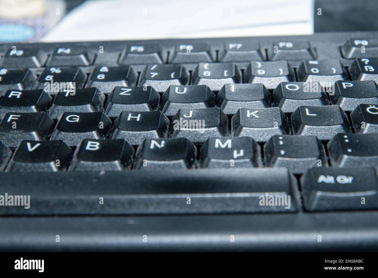 dusty computer keyboard in the home office Stock Photo
