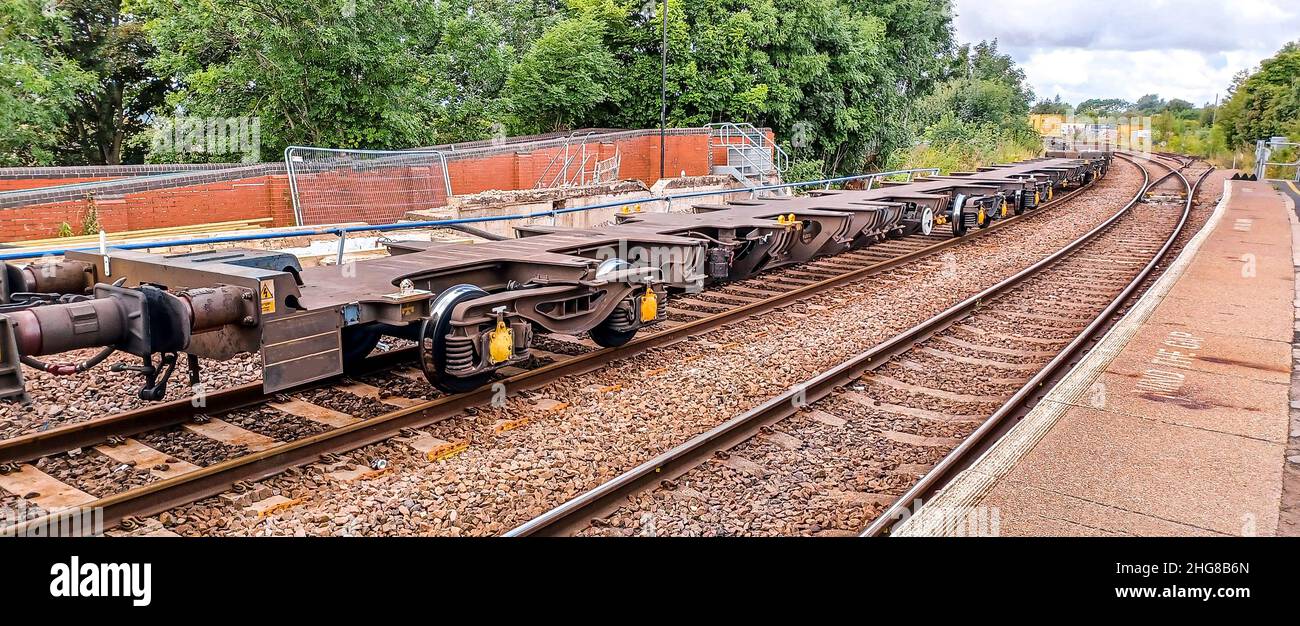 A freight train taking various types of carriages from A to B across