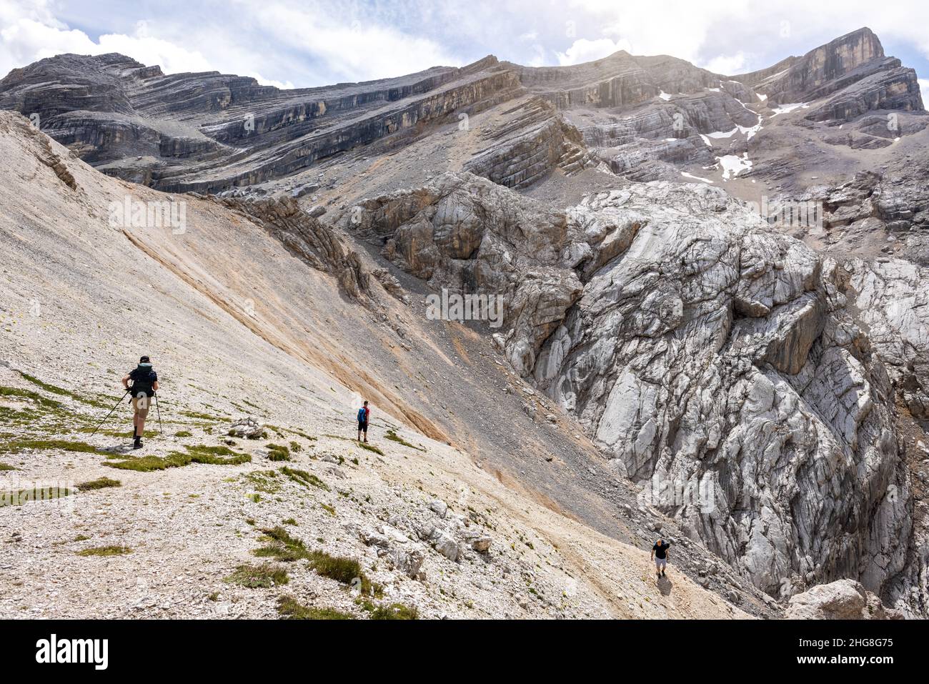 Hikers on their way down from a rough mountain top Stock Photo
