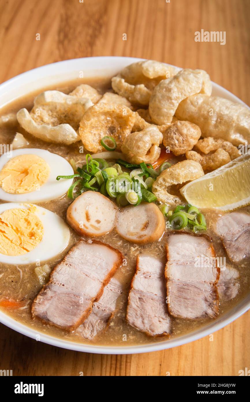 thick egg noodles with fried pork belly or also known as lechon lomi