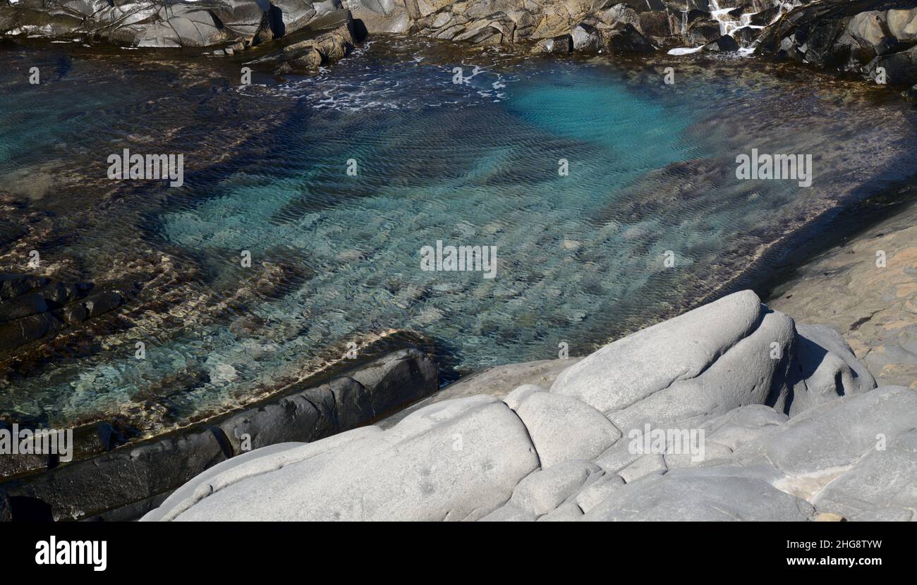 Gran Canaria, north coast, natural swimming pool Charco de Las Palomas  protected from the ocean waves by rock barrier Stock Photo - Alamy