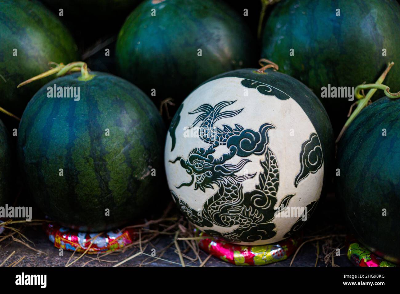 Delicious colorful local food on the market - watermelon carving for chinese new year. Traditional vietnamese cuisine in Ho Chi Minh, Vietnam. Stock Photo
