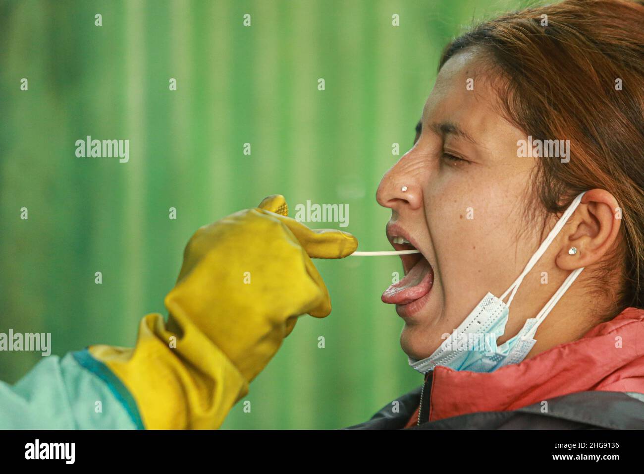 Bhaktapur, Bagmati, Nepal. 19th Jan, 2022. A paramedic reacts as she