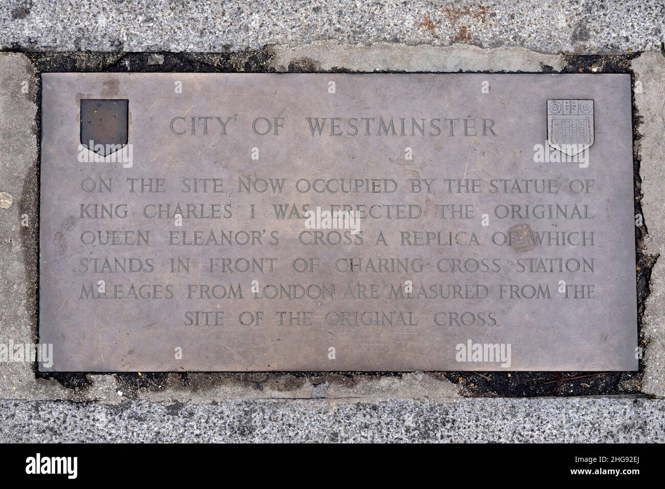 Commemorative plaque marking the spot, near Trafalgar Square, of the original Queen Eleanor's Cross and where all distances from London are measured. Stock Photo