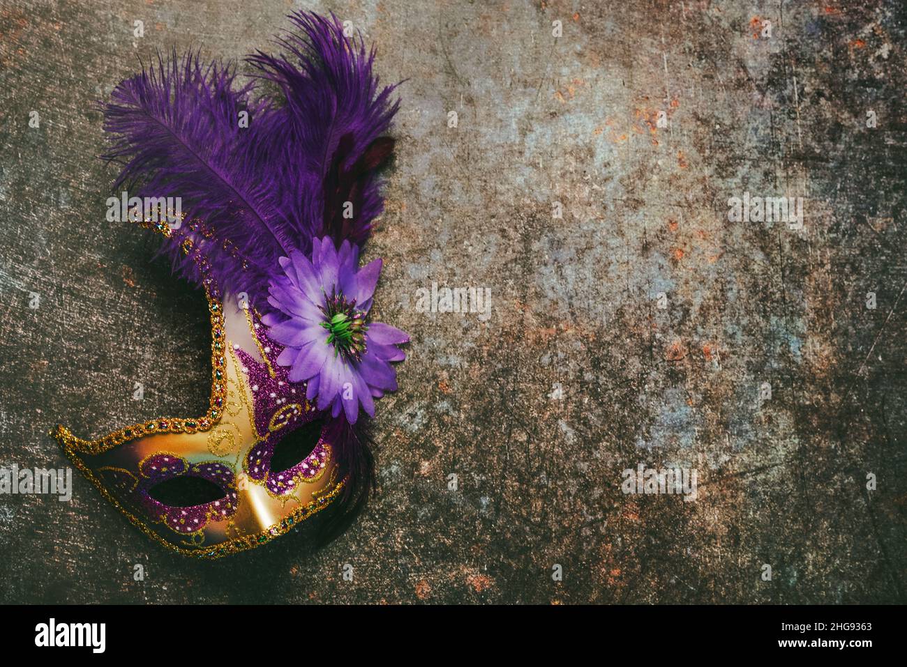 Venetian carnival mask  with copy space over grunge background. Carnival celebration concept Stock Photo