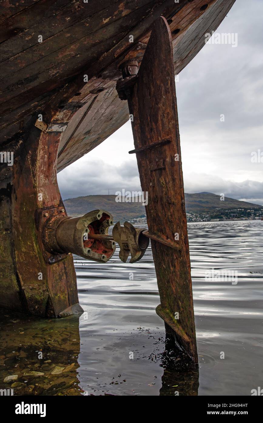 The Old Boat of Corpach, The Old fishing boat on the shingled shoreline of Loch Linnhe near Fort William , Scotland highland, UK Stock Photo