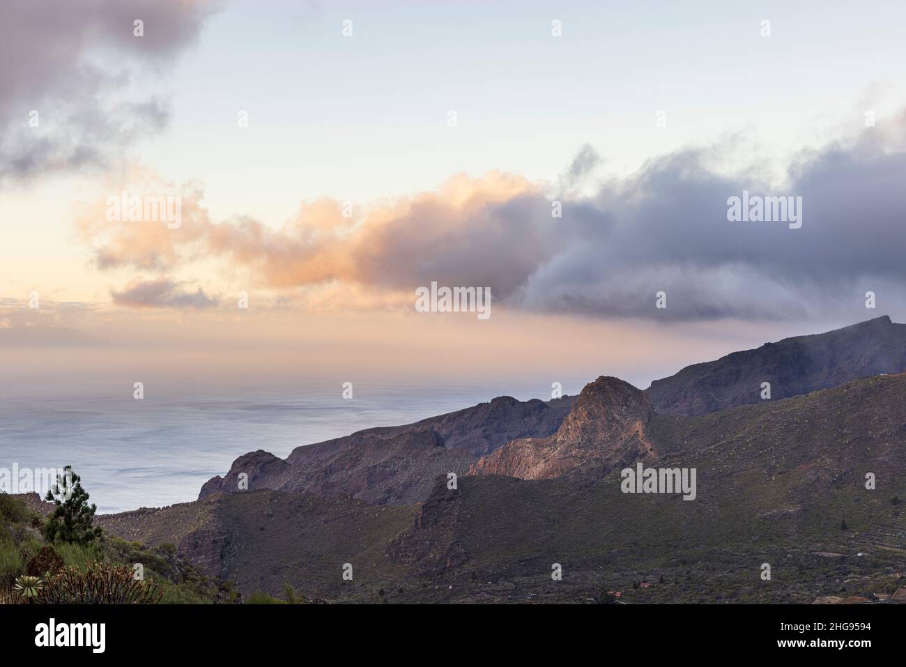 Dawn light and cloud over the los Gigantes cliffs and the Santiago valley, Santiago del Teide, Tenerife, Canary Islands, Spain Stock Photo