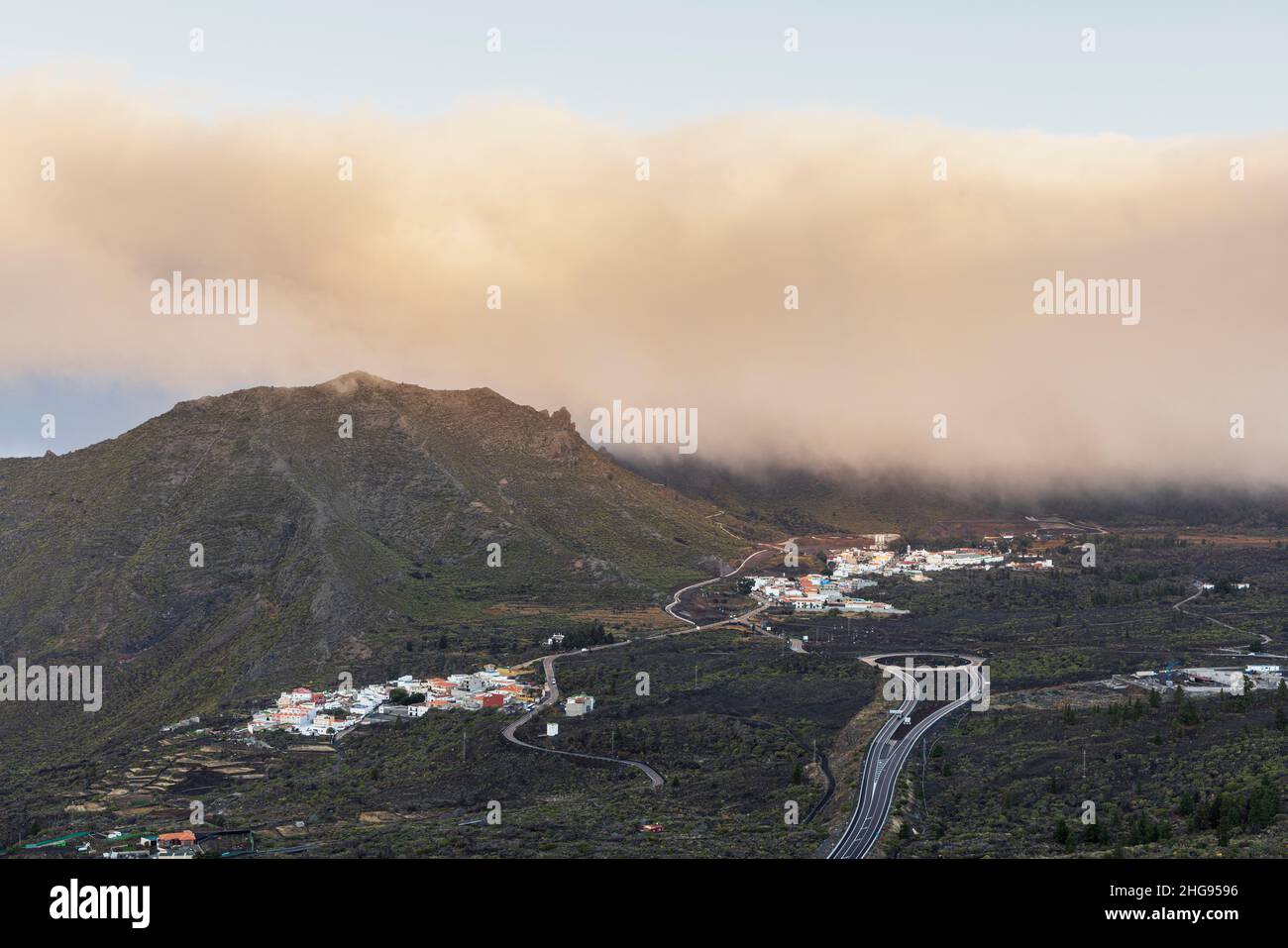Dawn light and mist over the Santiago valley and villages of El Molledo and Santiago del Teide, Tenerife, Canary Islands, Spain Stock Photo