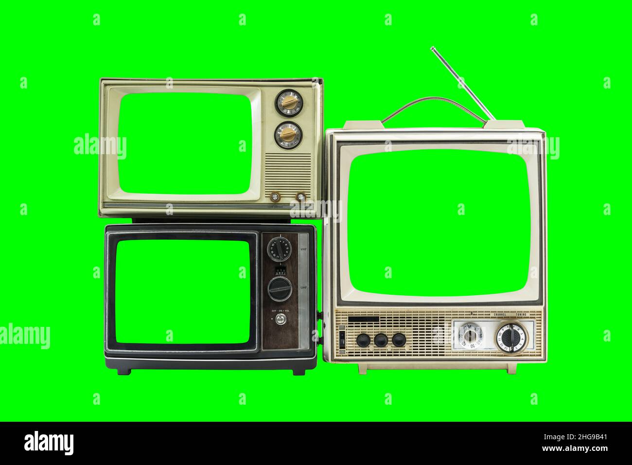 Three vintage televisions isolated with chroma key green screens and background. Stock Photo