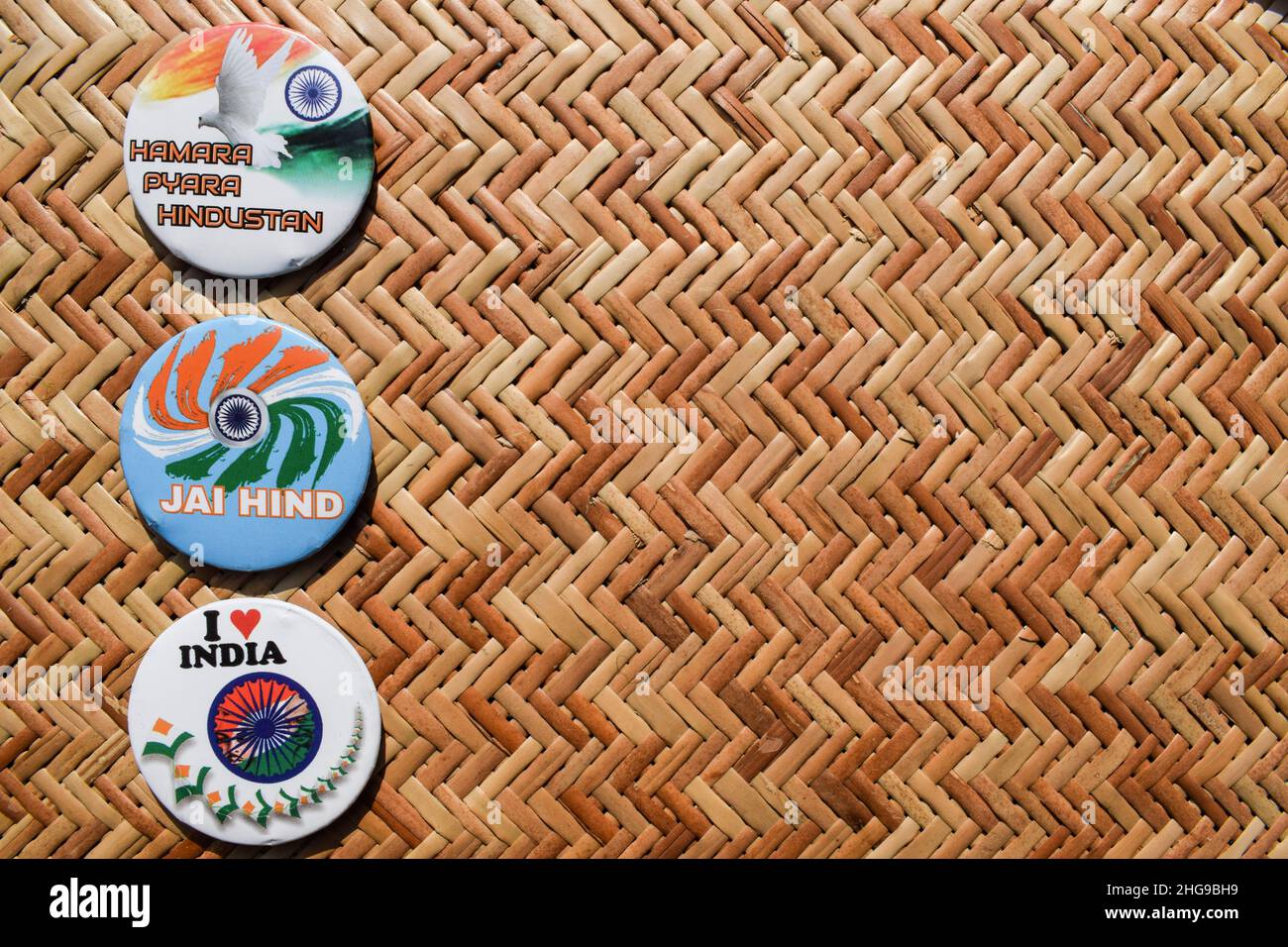 Indian Tricolour Badge pin written meaning ' Our lovely India' and Jai Hindi meaning hail India. Blank space to write text fonts posters theme Stock Photo