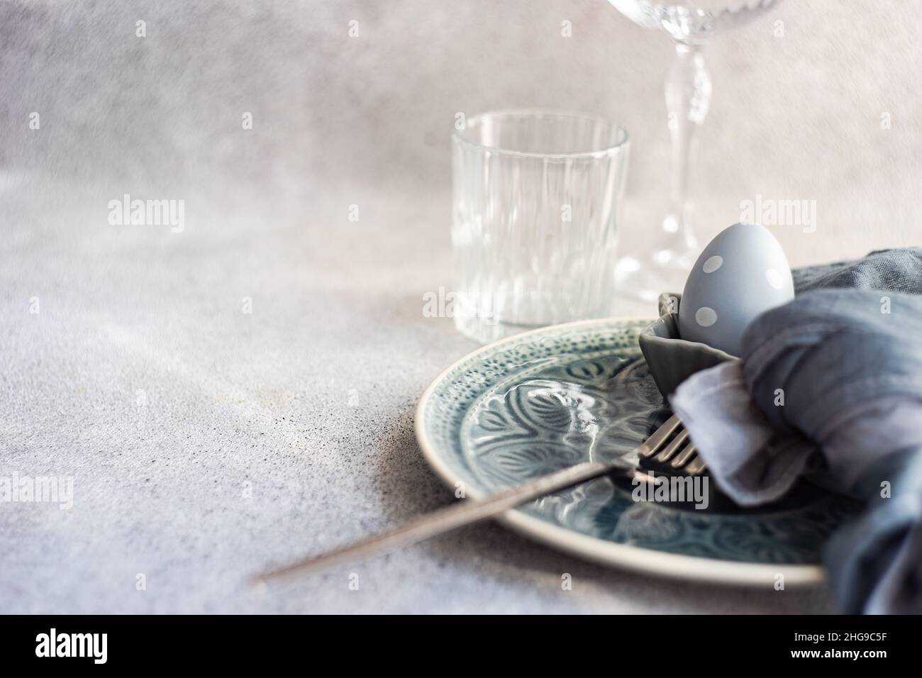 Festive Easter place setting with painted Easter eggs Stock Photo