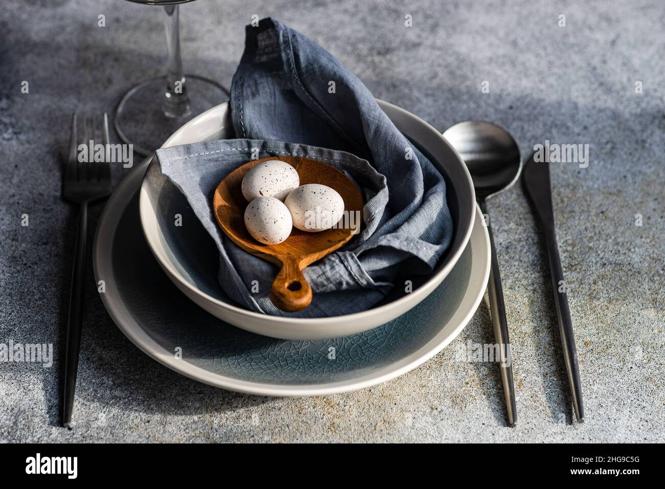 Overhead view of a festive place setting with Easter eggs Stock Photo