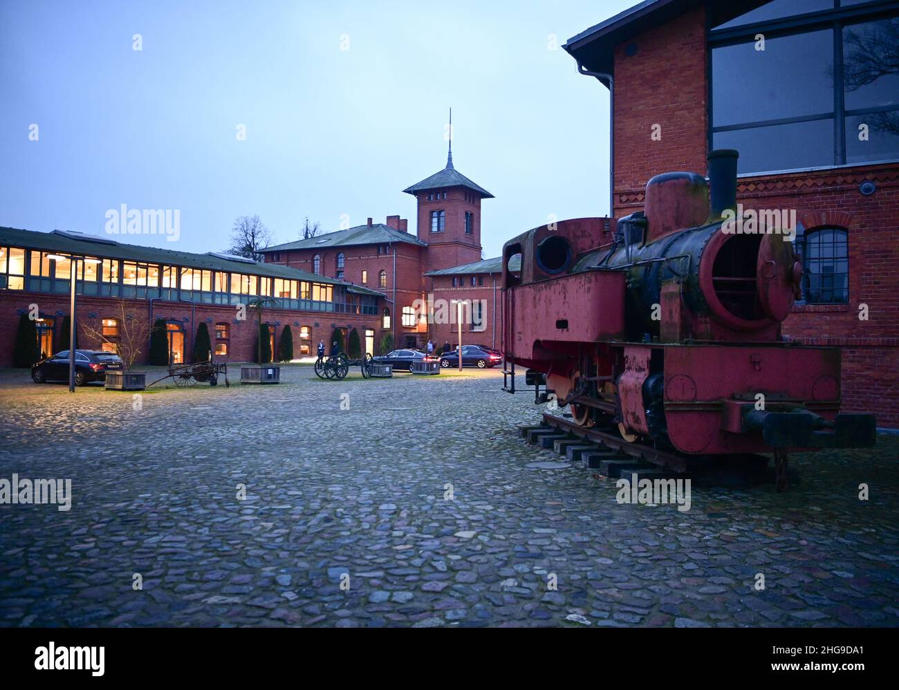 Nauen, Germany. 16th Jan, 2022. A historic steam locomotive stands in the courtyard of Landgut Stober. The former estate of the Borsig family is located on the Groß Behnitzer See lake and was voted the greenest hotel in Europe in 2017 and 2021 according to its own information. The conference hotel has 82 double rooms, 172 single rooms (new building) and 20 suites. Credit: Soeren Stache/dpa-Zentralbild/ZB/dpa/Alamy Live News Stock Photo