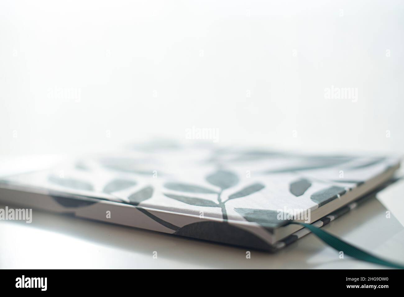 Close-up of a notebook lying on a table Stock Photo
