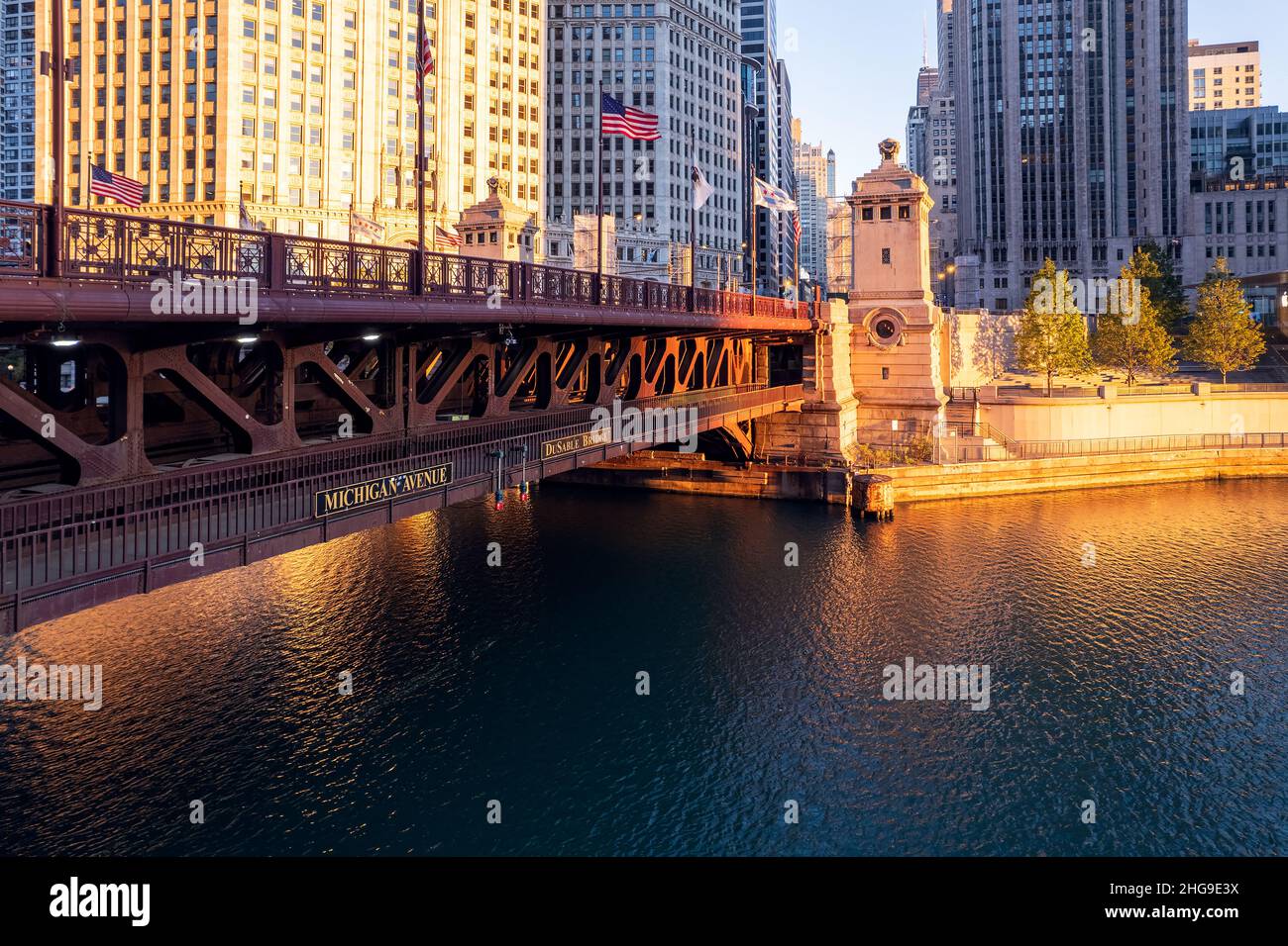 Downtown cityscape and Michigan Avenue bridge over Chicago river at sunrise, Chicago, Illinois, USA Stock Photo