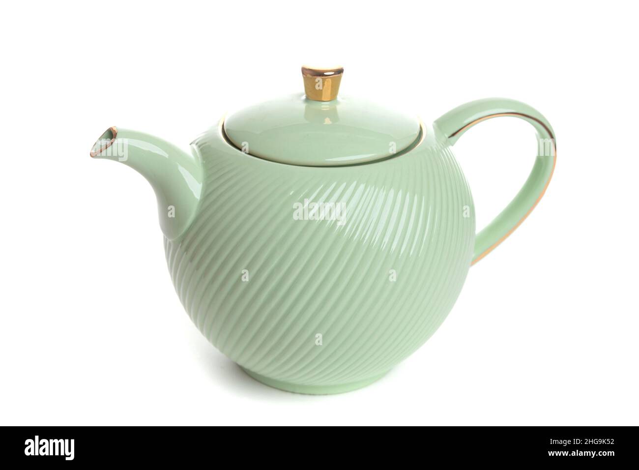 light green teapot on a white isolated background Stock Photo Alamy