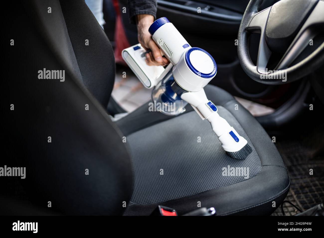 Car Seat Interior Cleaning With Portable Vacuum Cleaner Stock Photo Alamy