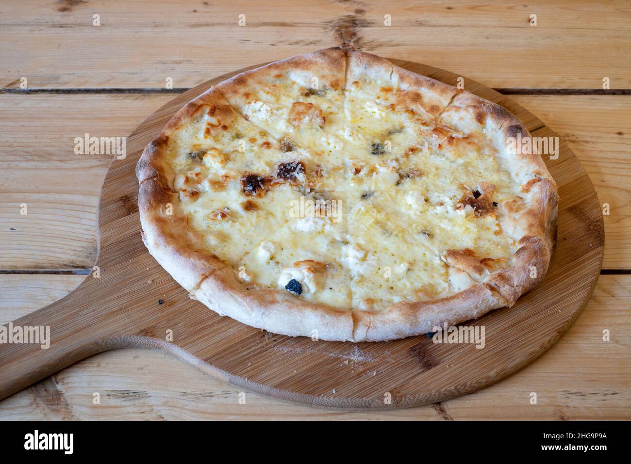 Delicious artisan woodfired handmade cheesy pizza garlic bread Stock