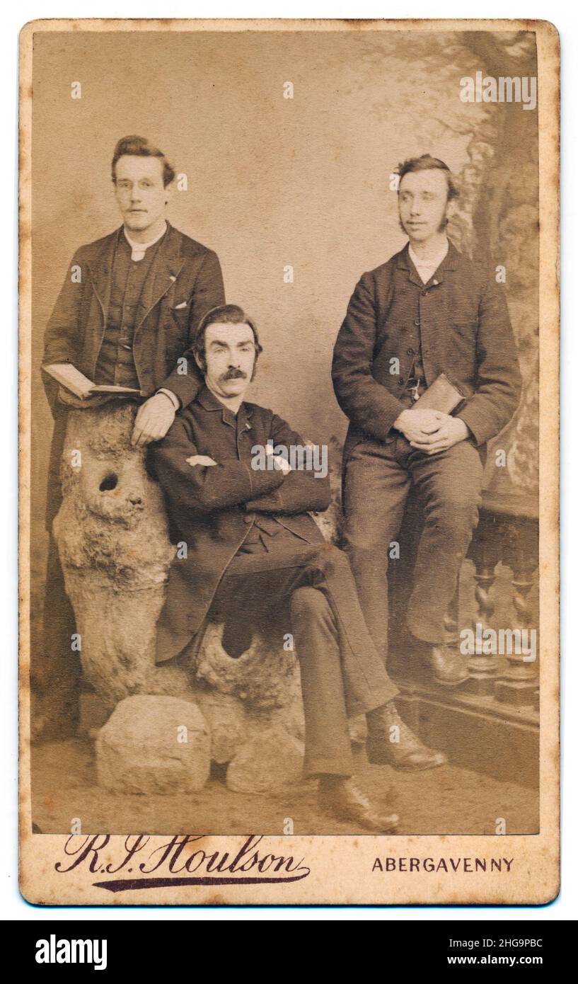 Example of an old and age stained Victorian carte de visiite card from about 1880 of a group of men taken by the Houlson studio, Abergavenny Stock Photo
