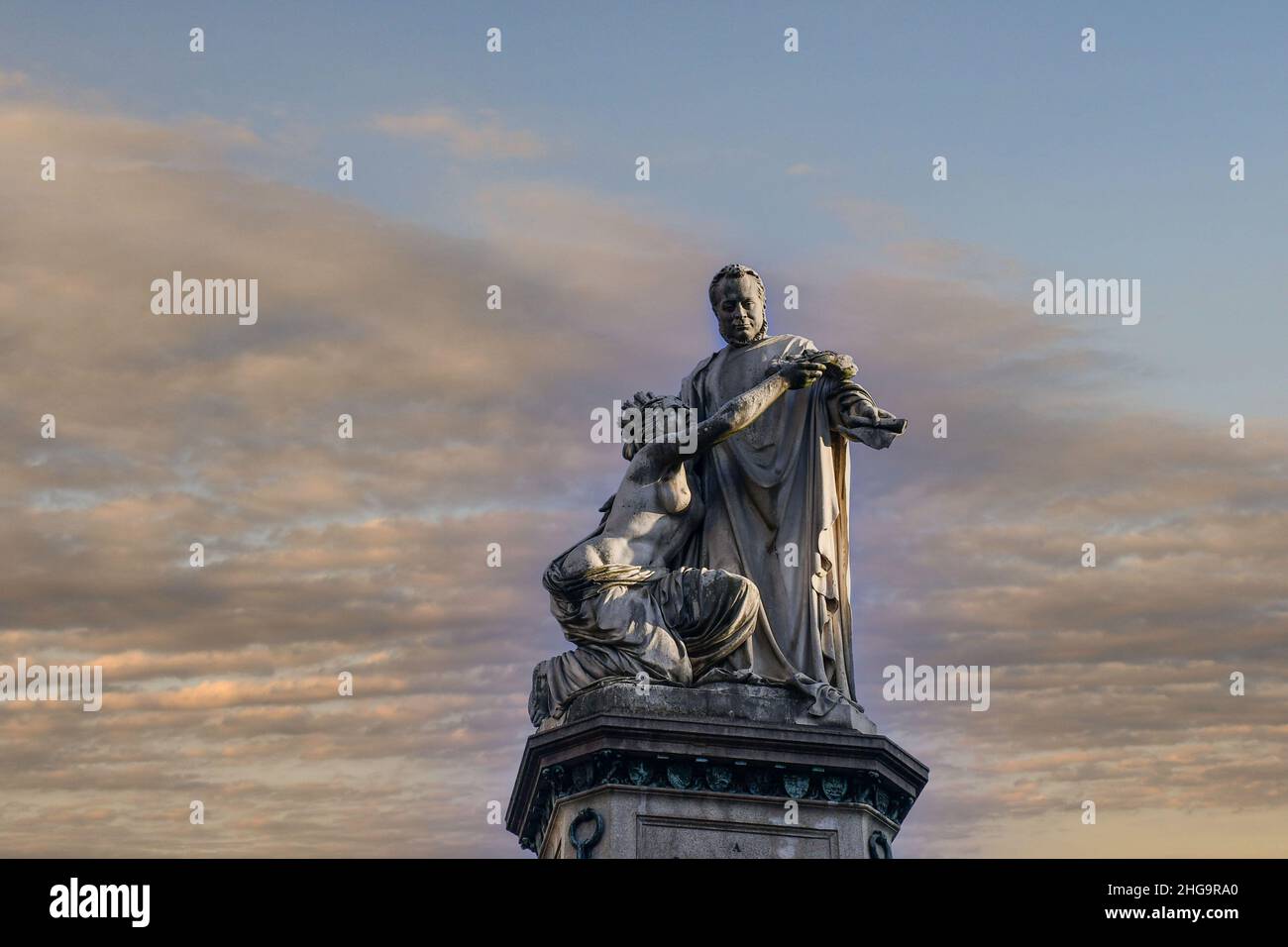 Close-up of the statue of Camillo Benso Count of Cavour by Giovanni Duprè (1872) agaist sunset sky in Piazza Carlina, Turin, Piedmont, Italy Stock Photo