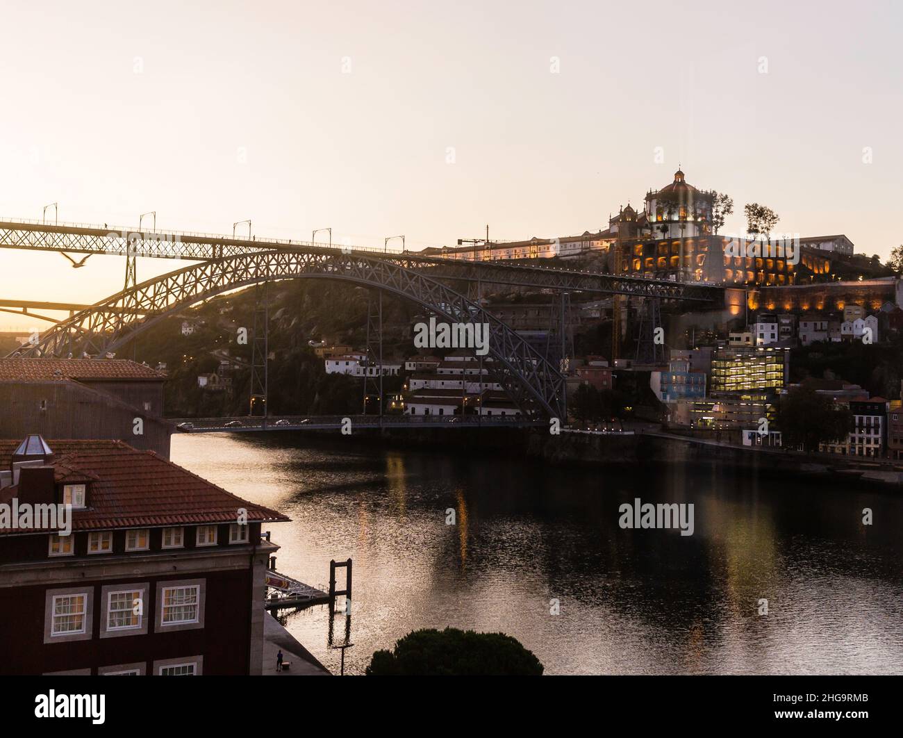 Porto, Portugal, dawn comes to the waterfront and Dom Luis l Bridge. Stock Photo
