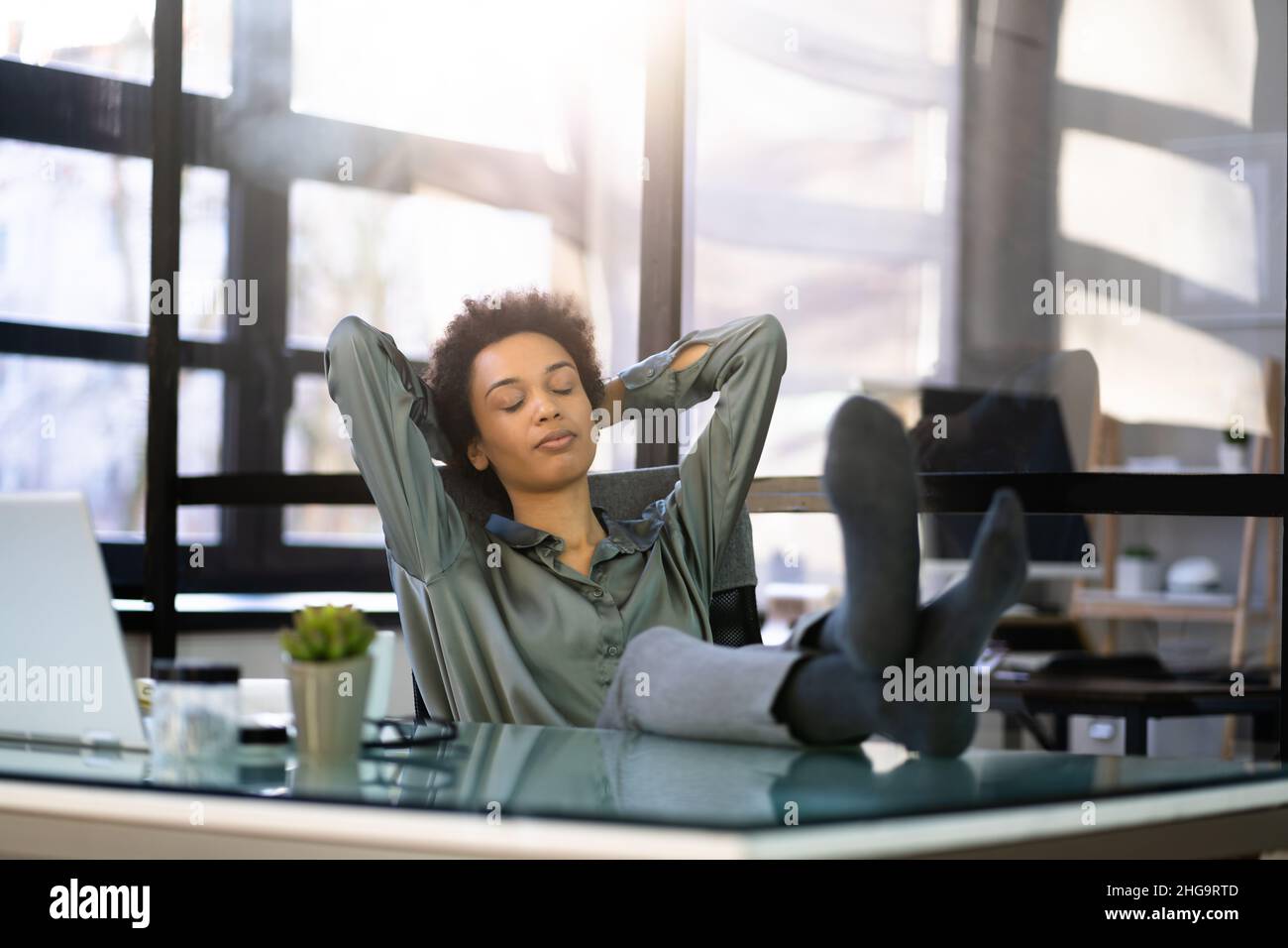 One woman sitting chair eyes closed hi-res stock photography and images ...