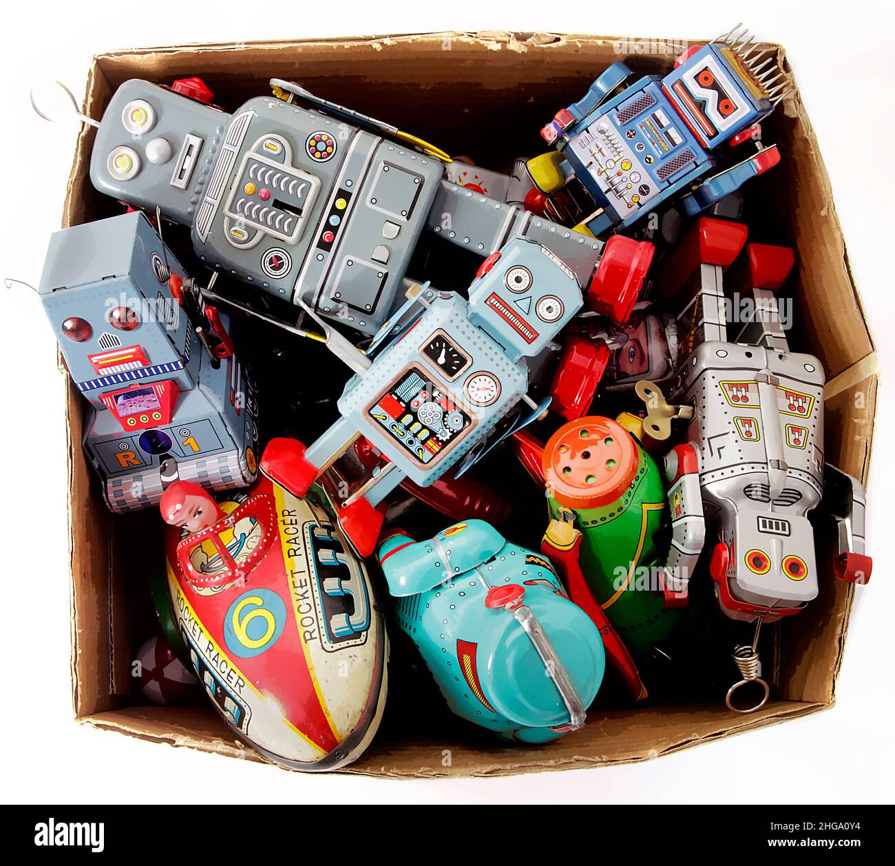 a box of retro toy robots taken from above isolated on white Stock Photo