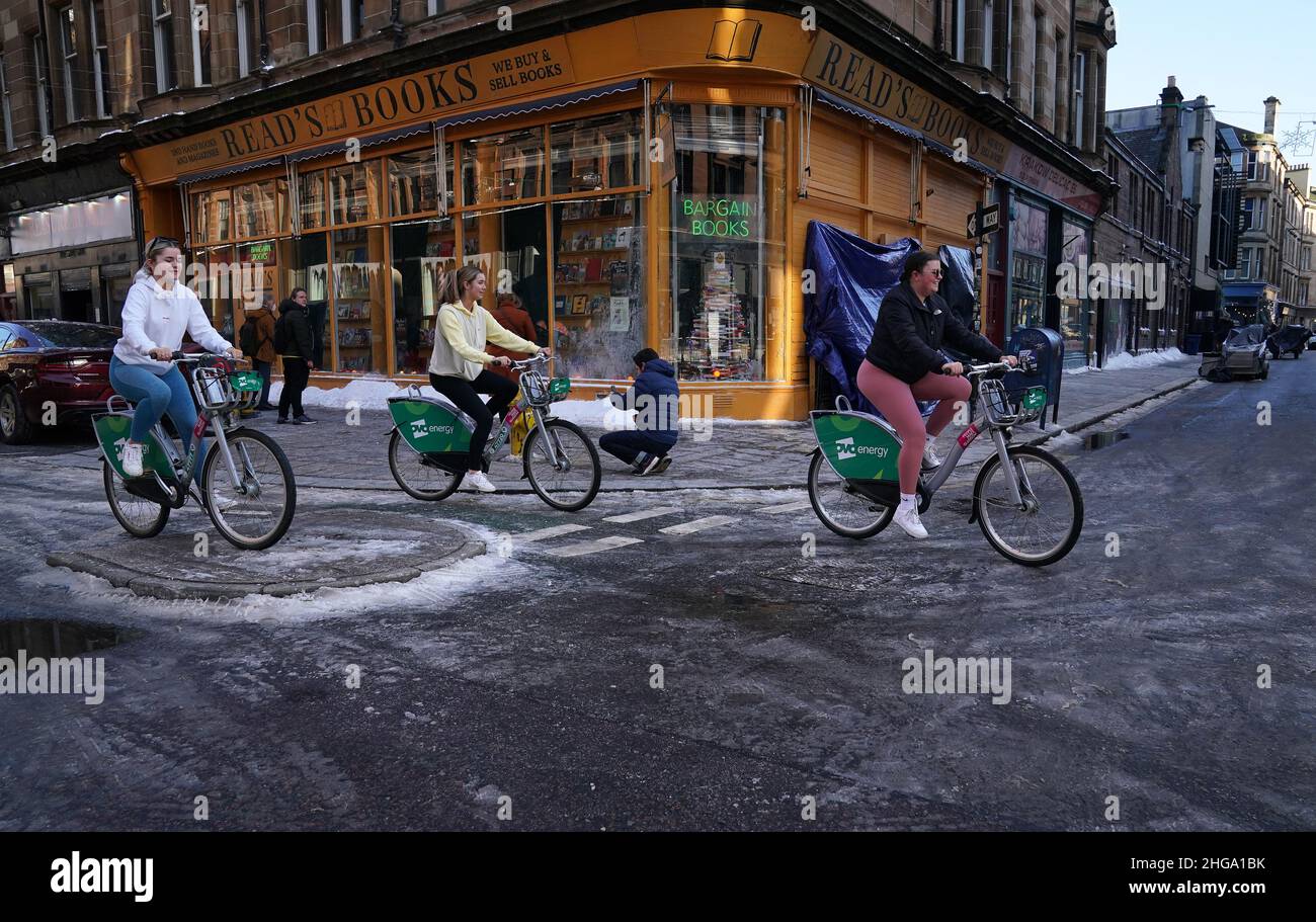 Members of the public cycle through the set of the new Batgirl movie