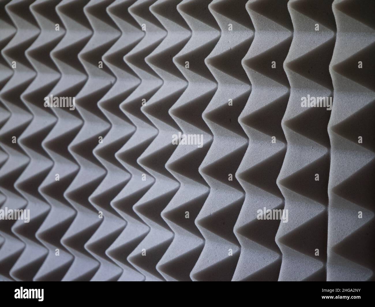 Grey acoustic foam rubber. Soundproof pyramids, full frame Stock Photo