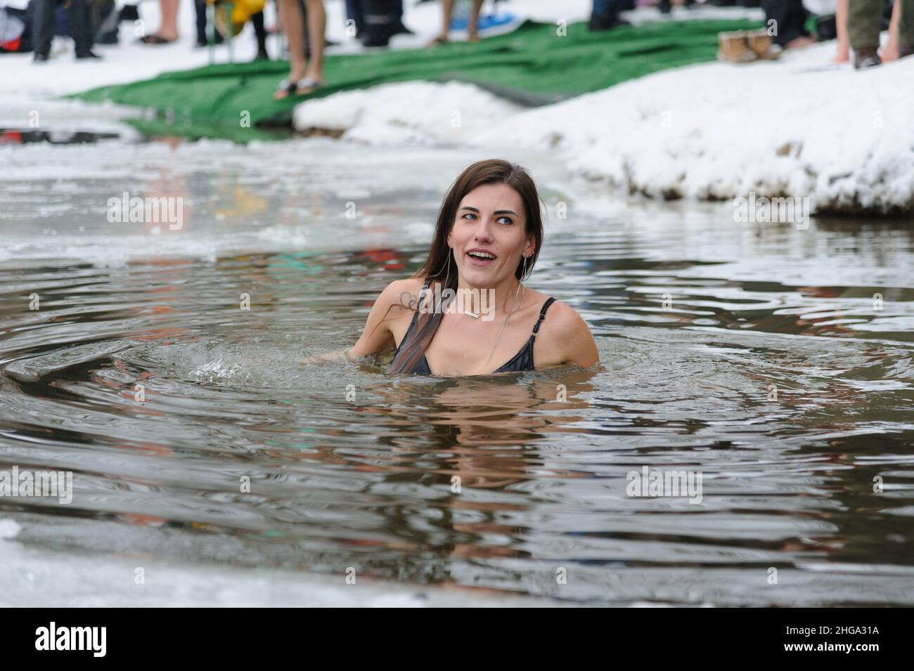 Lviv, Ukraine. 19th Jan, 2022. A woman takes a bath in cold water