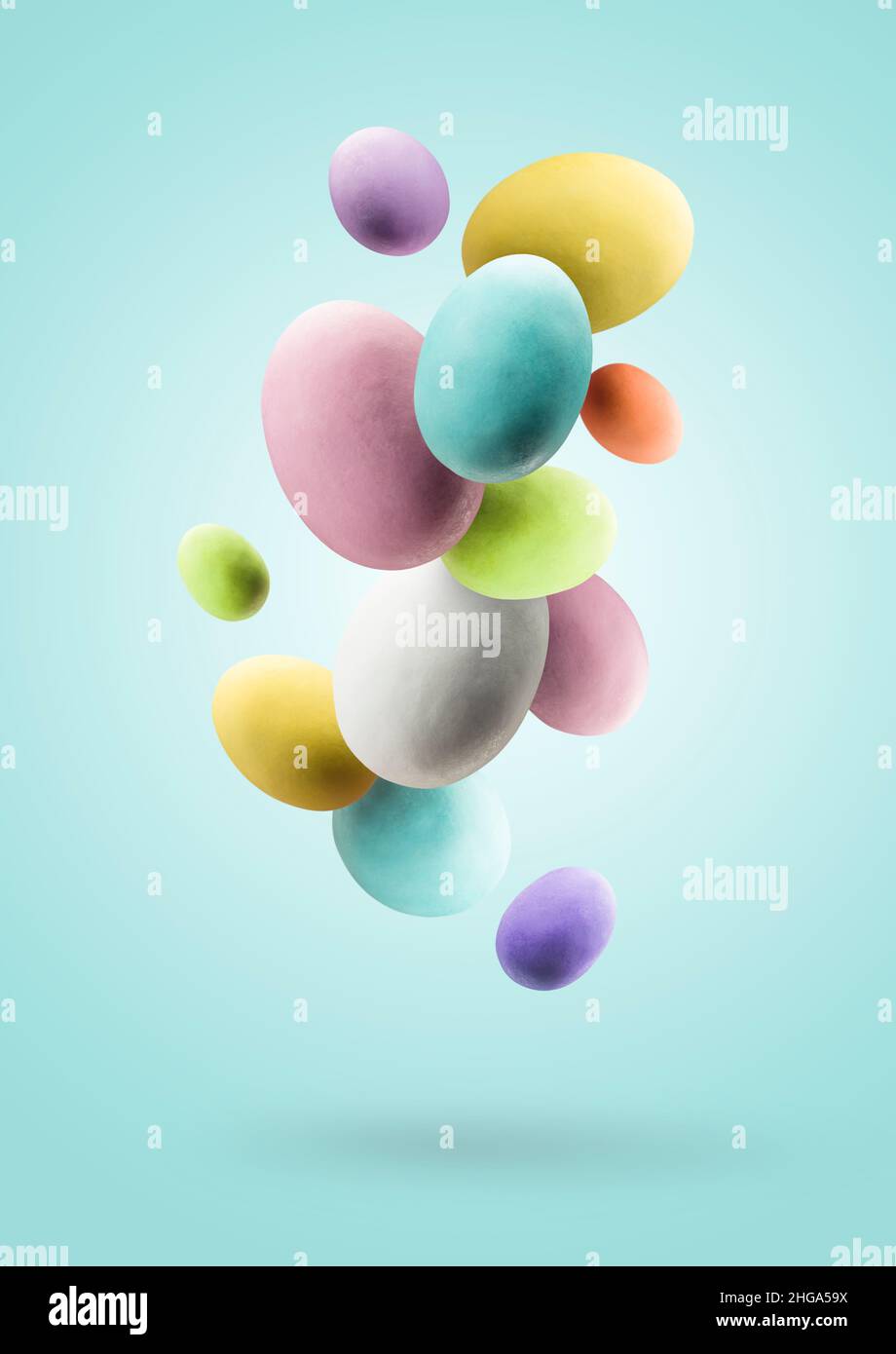 Easter eggs. Group of colored easter eggs jumping on blue background Stock Photo