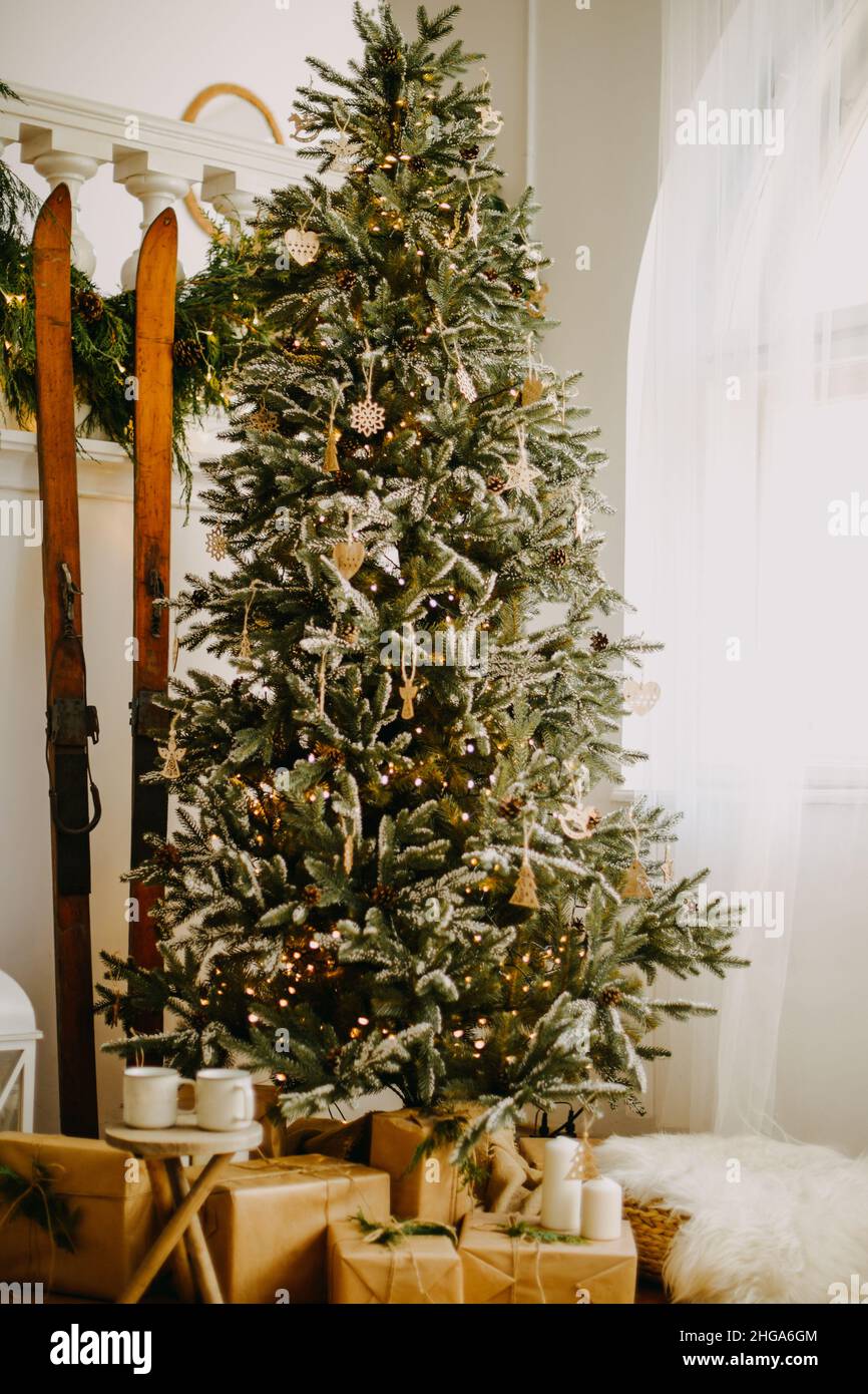 Big Lots Christmas Decor 2022 New Year 2022, Christmas. House Room Decorated For The Holidays. A Big Tree  At Home, A Lot Of Gifts Under The Tree And Skis Stock Photo - Alamy