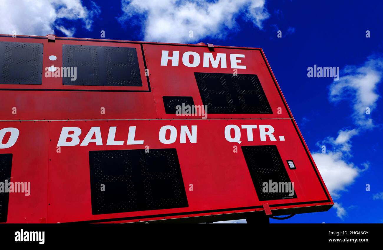 Baseball scoreboard red competition with blue sky and clouds Stock