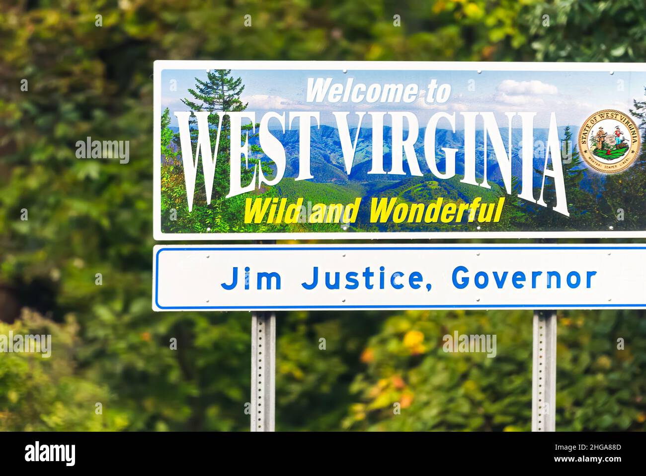 Wardensville, USA - October 5, 2020: Welcome to West Virginia sign Wild and Wonderful with mountains picture and blue sky by Virginia border and Jim J Stock Photo
